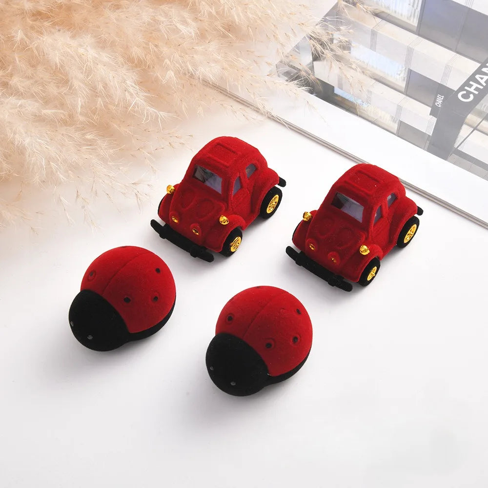 rangement bijoux forme voiture coccinelle rouge points noirs velours moderne portable