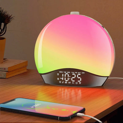 Réveil simulateur d'aube blanc avec lumière colorée sur table de chevet