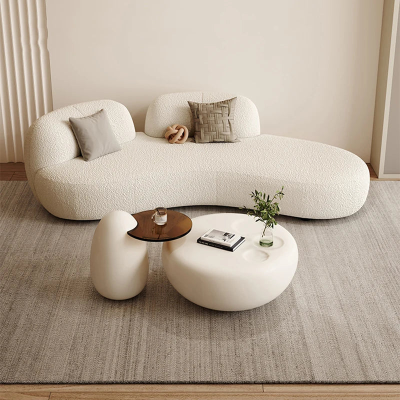 canapé lit blanc bouclé moderne table basse coussins décoratifs