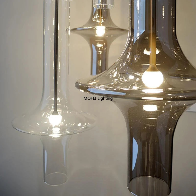suspension lumineuse transparent moderne câble suspendu salon chambre contemporaine lumière blanche neutre dorée