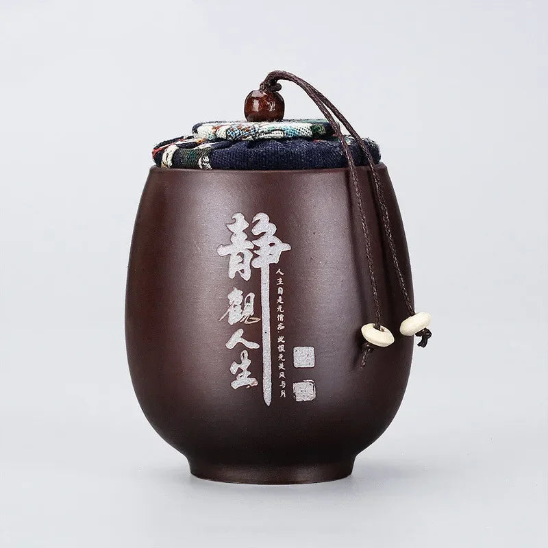 pot thé marron imprimé floral couvercle texte blanc classique traditionnel cordon boule bois épices