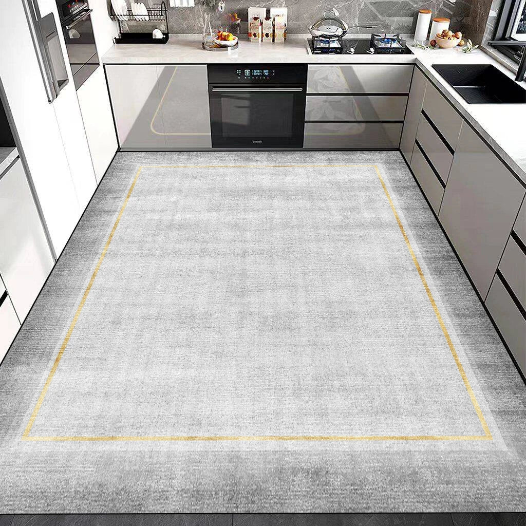 Cette image montre une cuisine moderne avec des meubles blancs et des appareils électroniques, ainsi qu'un sol gris avec des lignes jaunes qui créent un cadre visuel.