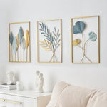 décoration murale métal feuilles stylisées bleu doré jaune art moderne salon maison intérieur