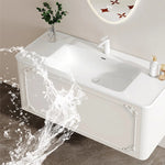 meuble salle bain noir blanc tiroirs vasque ornements dorés classique fixations murales accessoires cosmétiques