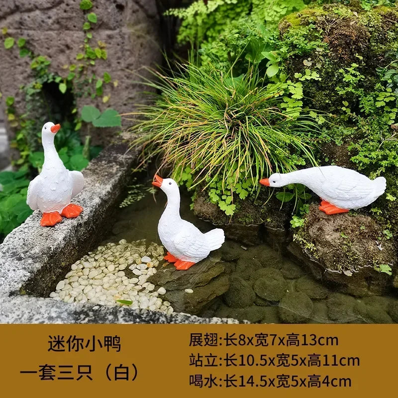 statue canard blanc plumes orange piscine jardin décoration extérieure animaux ornements paysagistes fleurs artificielles