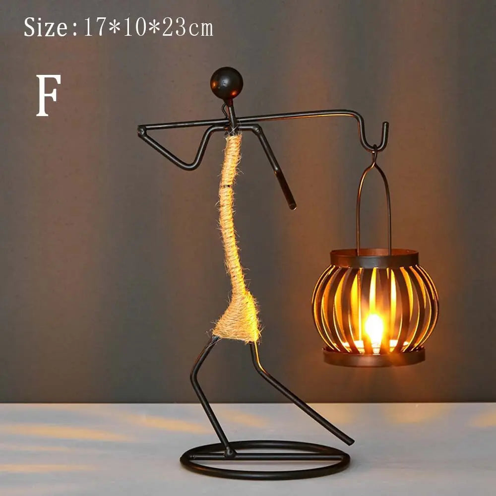 lanterne moderne minimaliste métal noir suspension bougie décoration intérieure contemporain porte chandelier abstrait