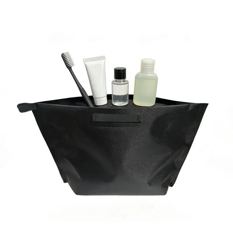 sac toilette noir texture hexagonale moderne fermeture glissière brosse dents crème parfum gel voyage