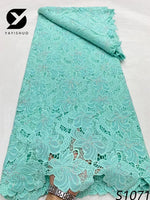 tissu dentelle bleu clair rose fleurs motifs floraux élégant dorées occasion partie