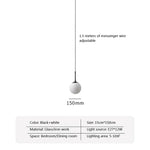 suspension lumineuse moderne or blanc sphères translucides pièces structure métal doré