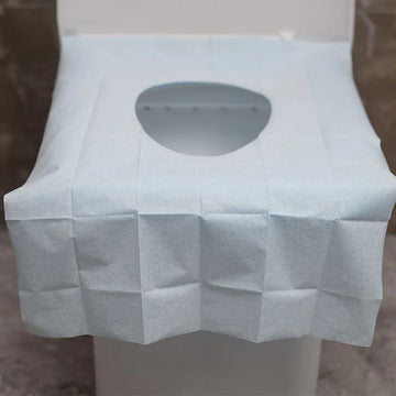 tapis toilette jetable papier bleu clair blanc texturé hygienique utilitaire ensemble points adhesion respectueux