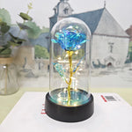 lampe led rose stabilisée dorée feuilles vertes moderne nuit multicolore base noire verre transparent