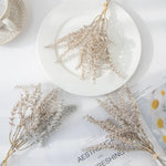 décoration intérieure bouquet feuilles artificielles naturel minimaliste beige gris doré