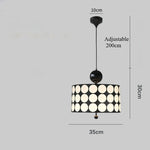 lampe suspendue moderne noire blanche rouge points blancs opacité chambre salonhôtel