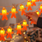 guirlande lumineuse noël père noël souriant orange noeuds papillons led festif