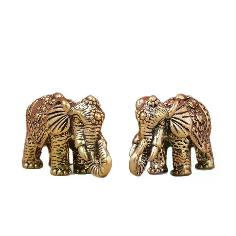 statuette éléphant bronze doré décoration florale motifs géométriques texture rugueuse traditionnel asiatique ornement métallique