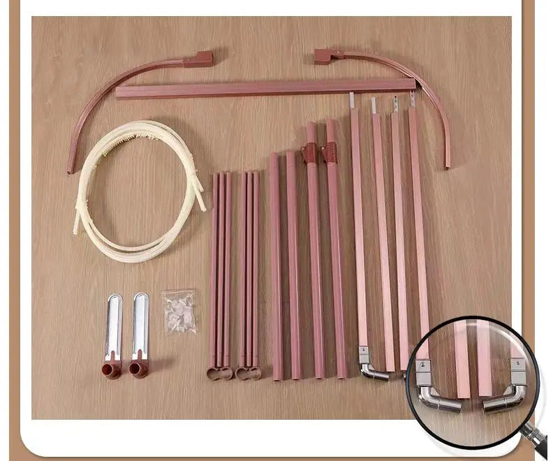 Ensemble de composants pour l'assemblage de meubles, comprenant diverses tiges métalliques rose et blanches ainsi que des accessoires complémentaires.