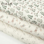 tissu imprimé fleurs lapins blanc rose vert bleu clair vintage enfantin résistant déchirure bricolage