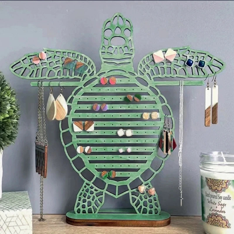 porte bijoux tortue verte bois clair ajouré motifs horizontaux naturel marin suspendu