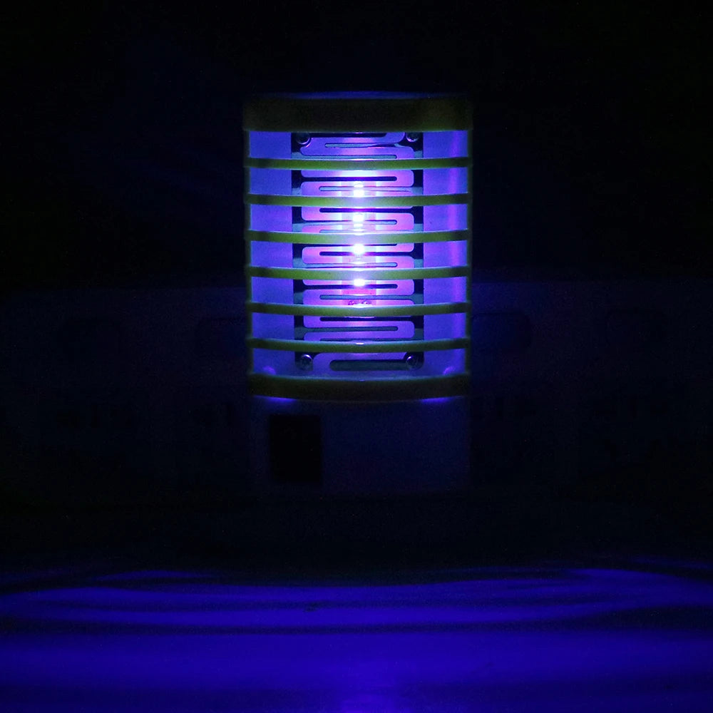 lampe anti moustiques prise électrique moderne rose verte grille métallique trappe transparente
