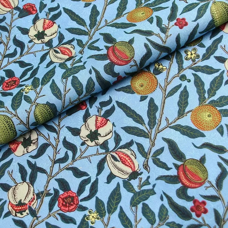 tissu coton imprimé floral motifs fruits pommes citrons couleurs vives noir bleu turquoise orange
