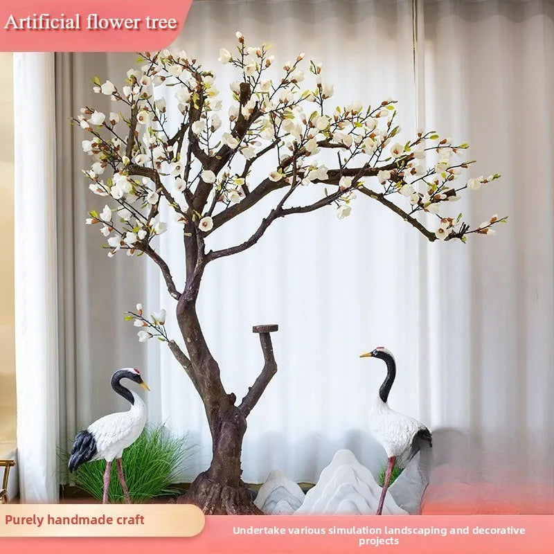 arbre artificiel magnolia fleurs blanches feuilles vertes tronc brun oiseaux rochers decoration exterieure decoration