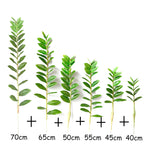 plantes artificielles branches vertes feuilles simples extérieur moderne pot blanc exposé