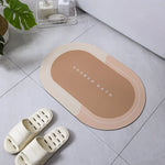 tapis bain moderne ovale motifs pas couleurs bleu marine gris clair rose violet texture