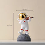 statue astronaute résine saxophone doré guitare violoncelle moderne décoration intérieure chambre salon