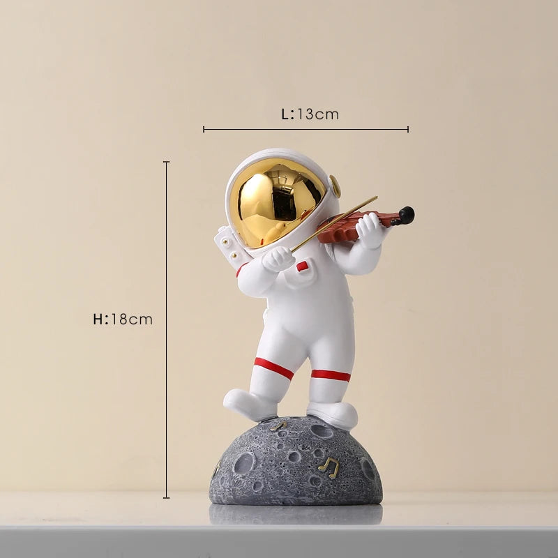statue astronaute résine saxophone doré guitare violoncelle moderne décoration intérieure chambre salon