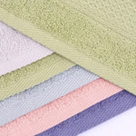 serviettes bain coton bleu clair vert rose gris absorbantes texture tissée bordure ornée classique