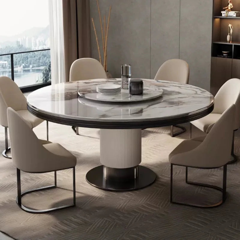 table ronde marbre moderne blanc gris pivotante chaise dorée minimaliste assise vase assiettes salière