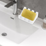 support savon moderne silicone couleur noir vert clair motif abstrait sourires texture douce salle