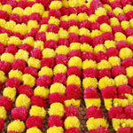 guirlandes artificielles fleurs pompons jaune rouge orange festives traditionnelles