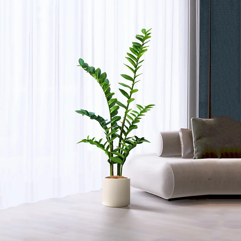 plantes artificielles branches vertes feuilles simples extérieur moderne pot blanc exposé