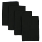 Des serviettes de table noires empilées sur un fond blanc, leur texture et leur couleur foncée contrastant avec l'arrière-plan clair.