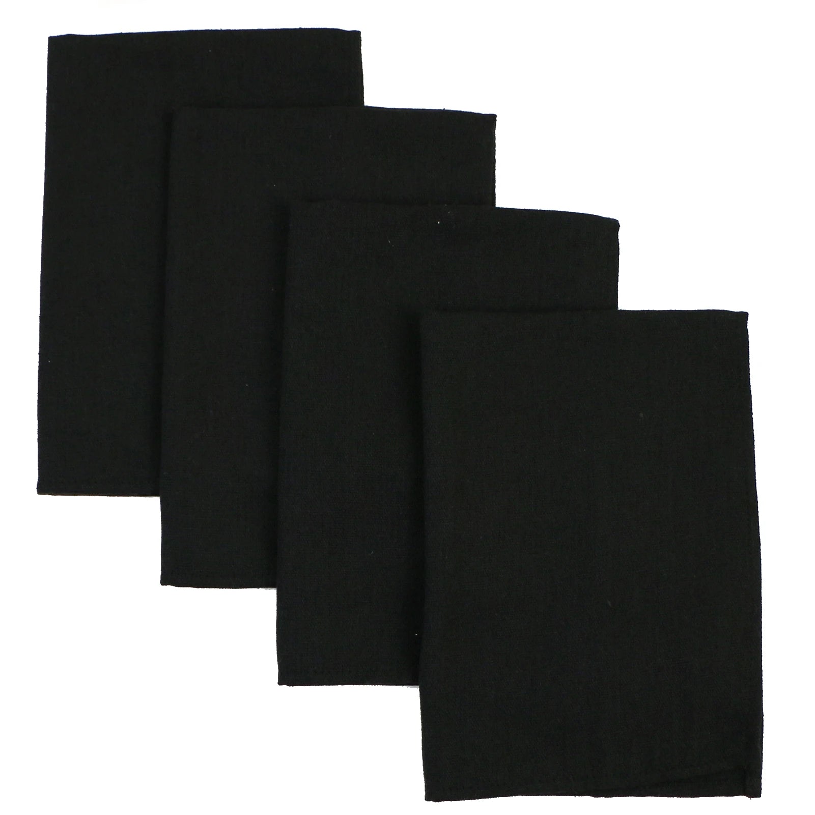 Des serviettes de table noires empilées sur un fond blanc, leur texture et leur couleur foncée contrastant avec l'arrière-plan clair.