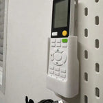 boîte rangement télécommandes blanc texture rugueuse adhésif pratique moderne stockage