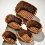 paniers osier marron clair tressage traditionnel poignées cuir noir rangement cuisine respectueux environnement