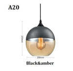 suspension lumineuse moderne pendentif verre noir transparent contemporain fixation câble luminaire salle manger chambre