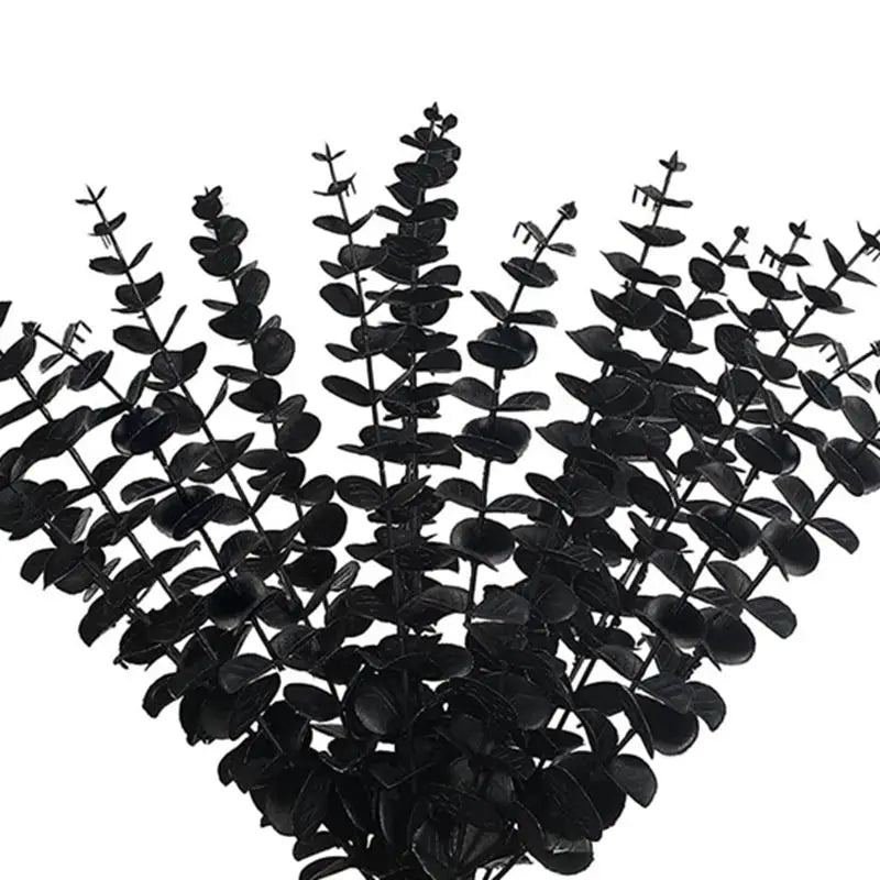 bouquet artificiel feuilles vertes naturel minimaliste ruban blanc vase blanc tapis beige ornement extérieur