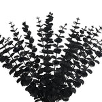 bouquet artificiel feuilles vertes naturel minimaliste ruban blanc vase blanc tapis beige ornement extérieur