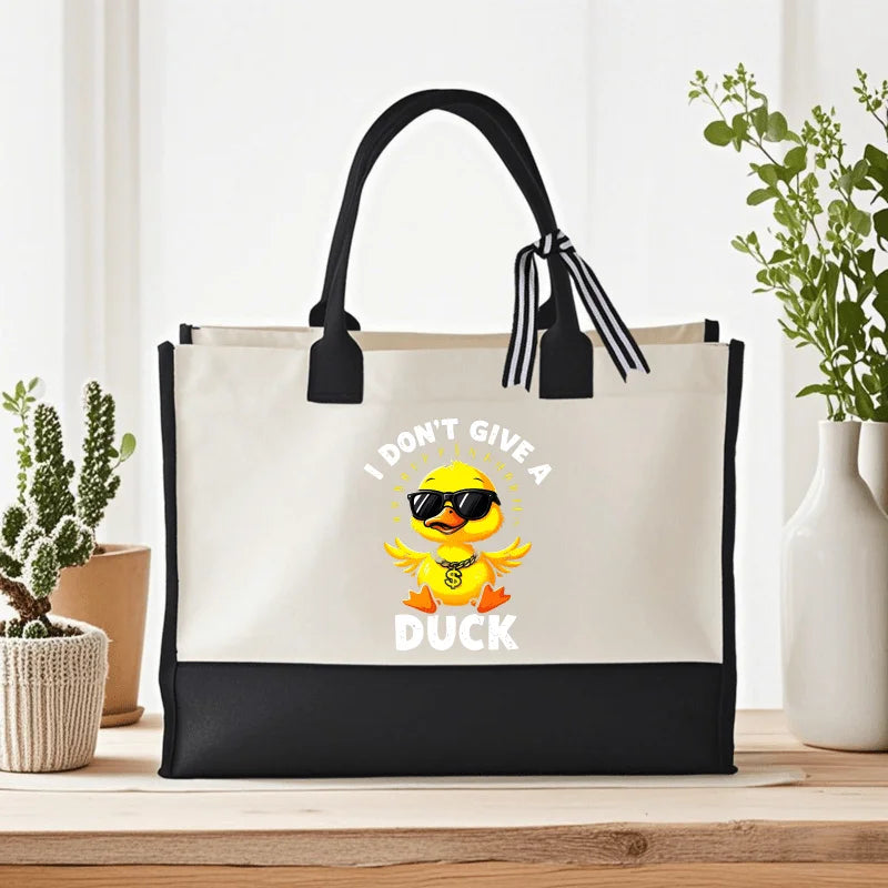 sac main toile beige noir canard lunettes soleil respectueux environnement moderne casual