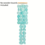 mobile musical wind chimes disques texturés turquoise vert clair zenextérieur jardin balcon