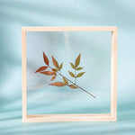 cadre photo bois double face nature morte feuilles brindilles ours peluche minimaliste deco maison
