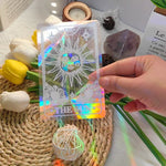 étiquettes solaires holographiques transparentes motifs planètes chats soleils modernes adhésives blanches minimalistes