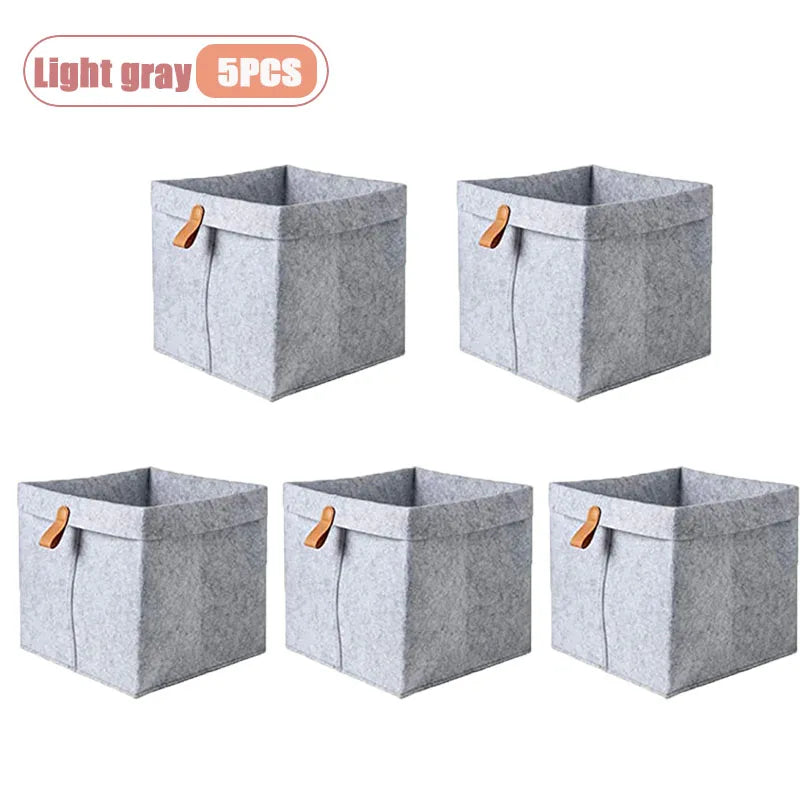 boîte rangement tissu veloutée gris clair foncée moderne pliable articles divers serviettes blanches broderie
