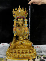 statue bouddhiste or turquoise rouge blanche motif complexe texture lisse traditionnel lotus assis grande