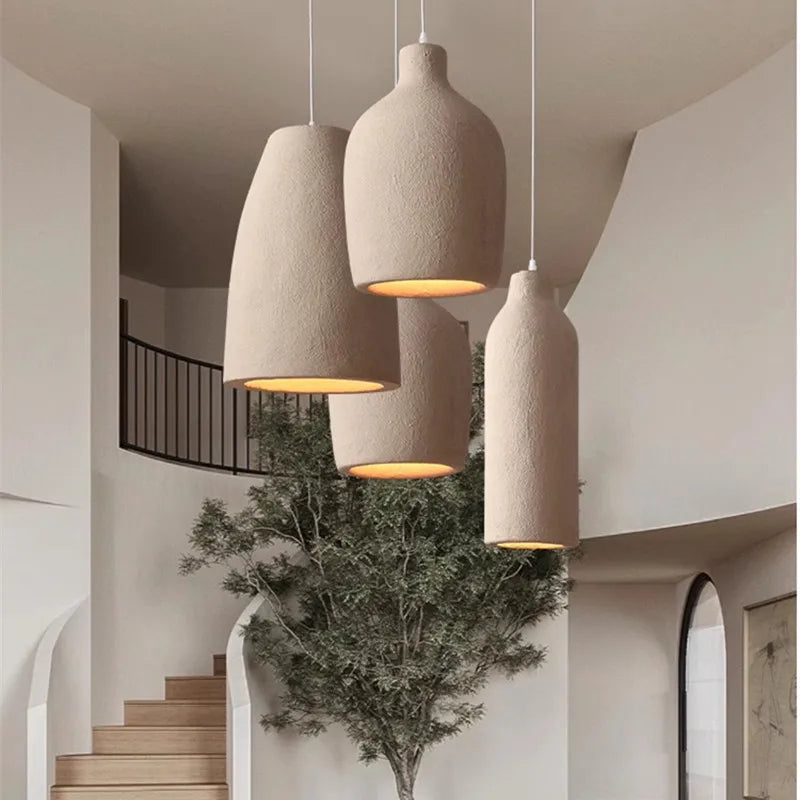 suspension lumineuse pendentif résine beige clair texture granuleuse moderne salon chambre principal