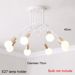 suspension lumineuse moderne noir doré ampoules blanches structure spirale fixation câbles métallique