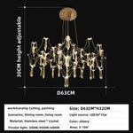 lustre moderne or cristaux transparents branches stylisées salon chambre principale